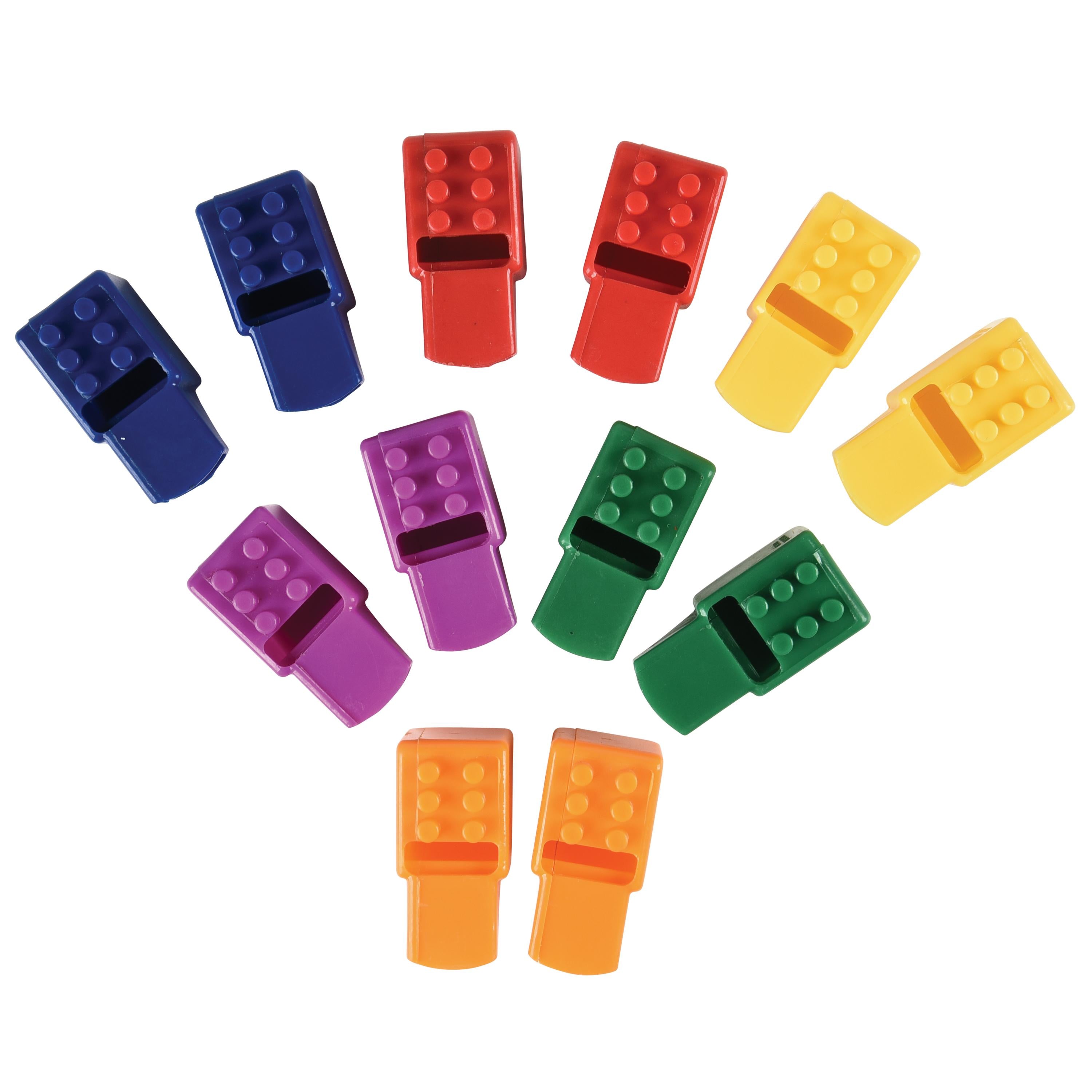 Colorful plastic building block whistles on a white background