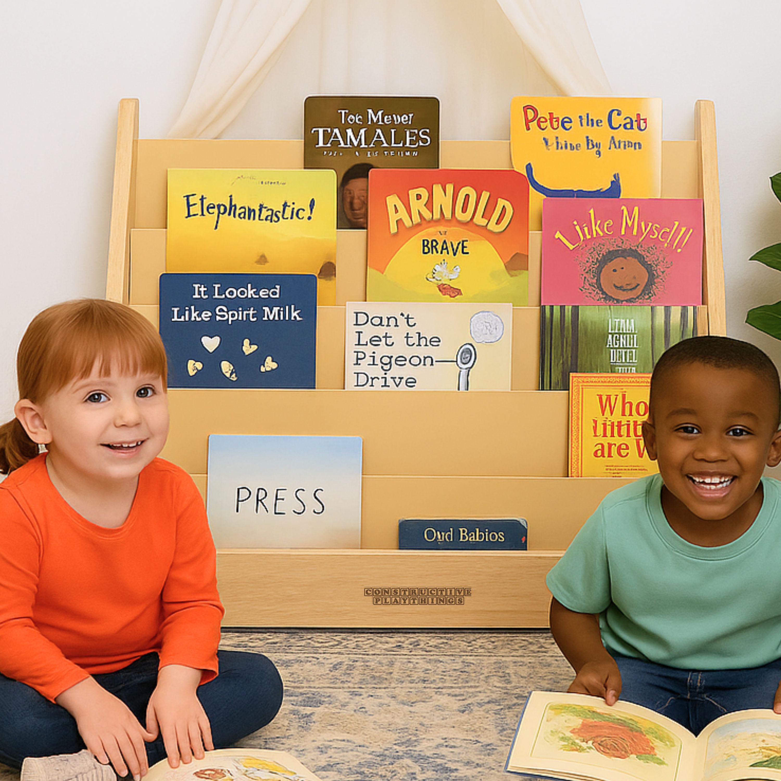 Two children sitting in front of a wooden bookshelf with various books displayed.