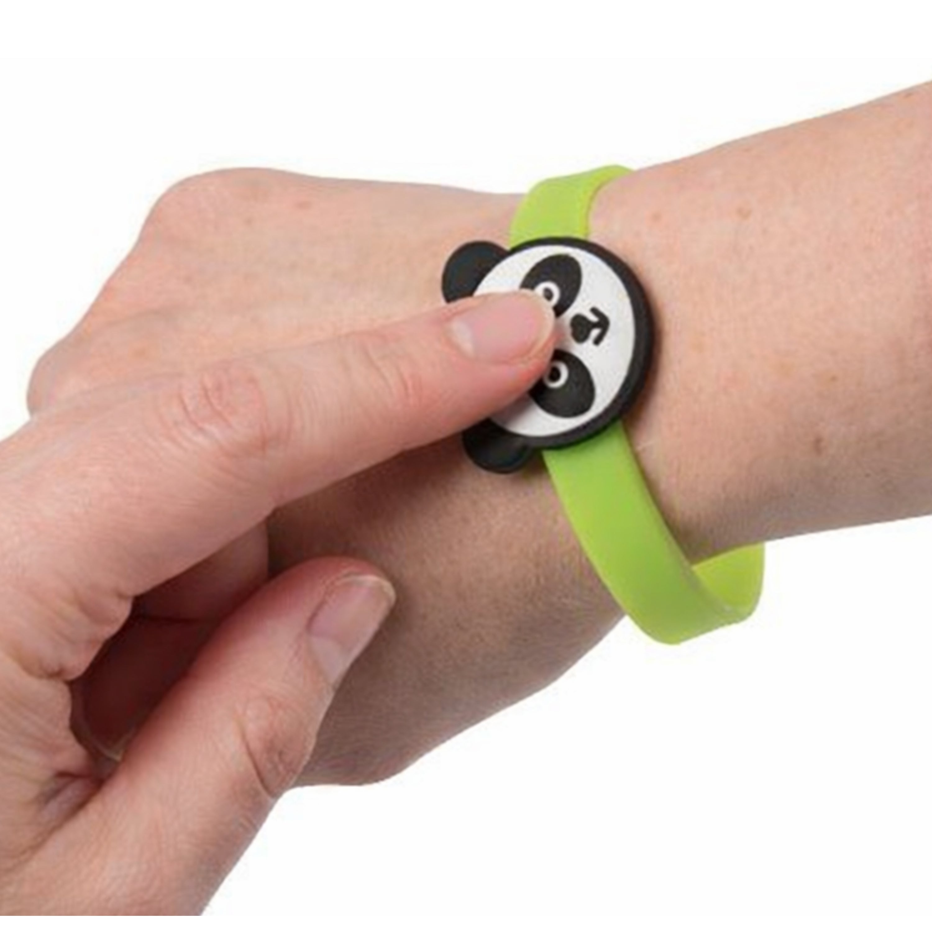 Person wearing a green wristband with a panda design on a white background