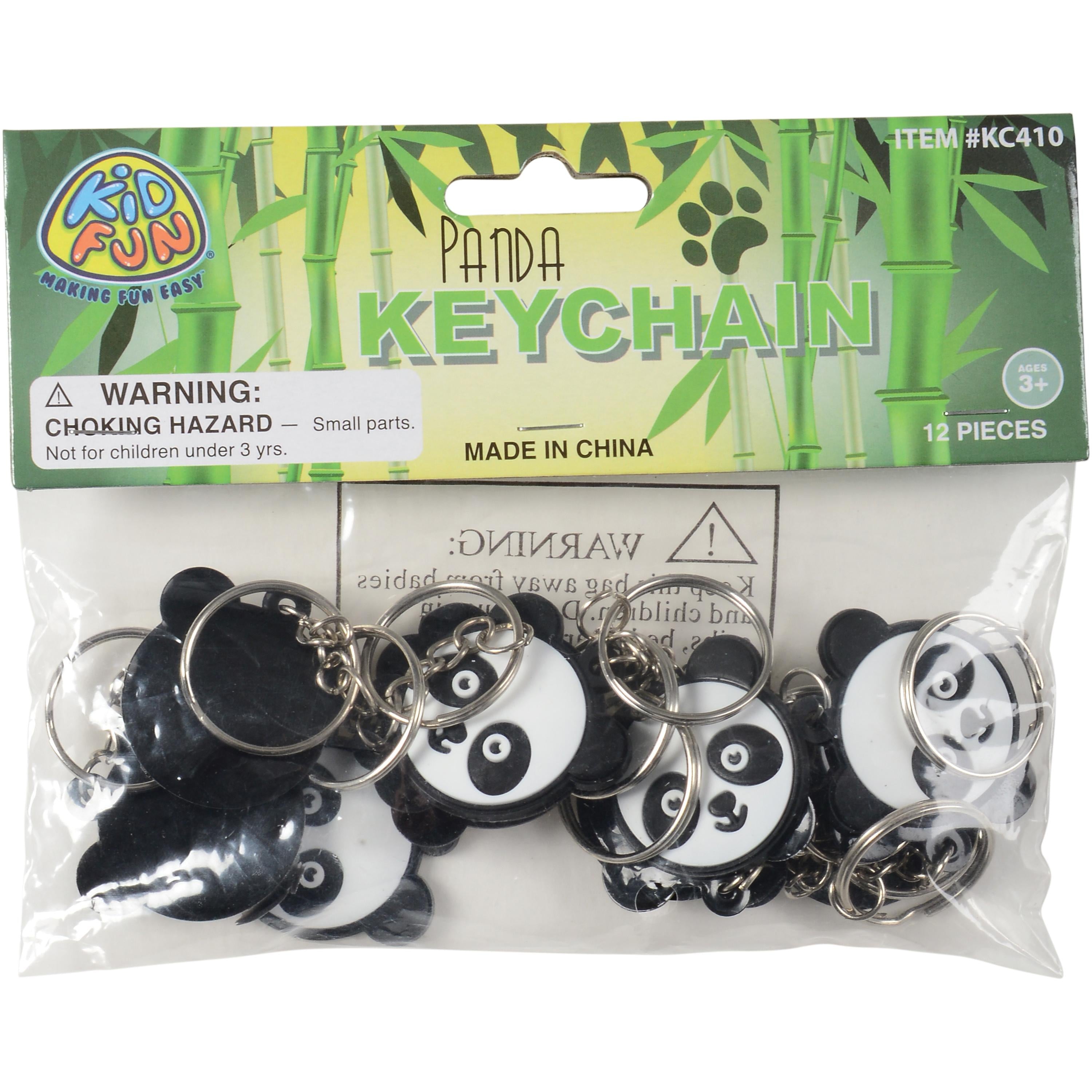 Packaged panda keychains with warning label on a white background