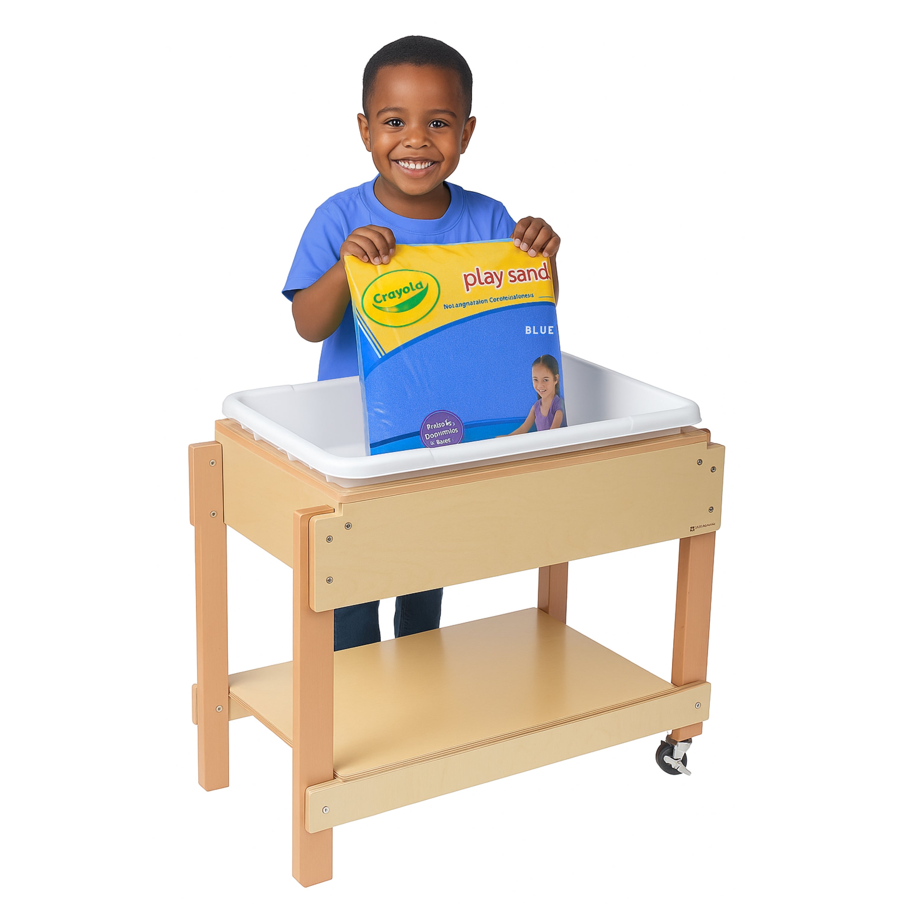Child holding a Crayola play sand package in front of a wooden sand table with a white lid.
