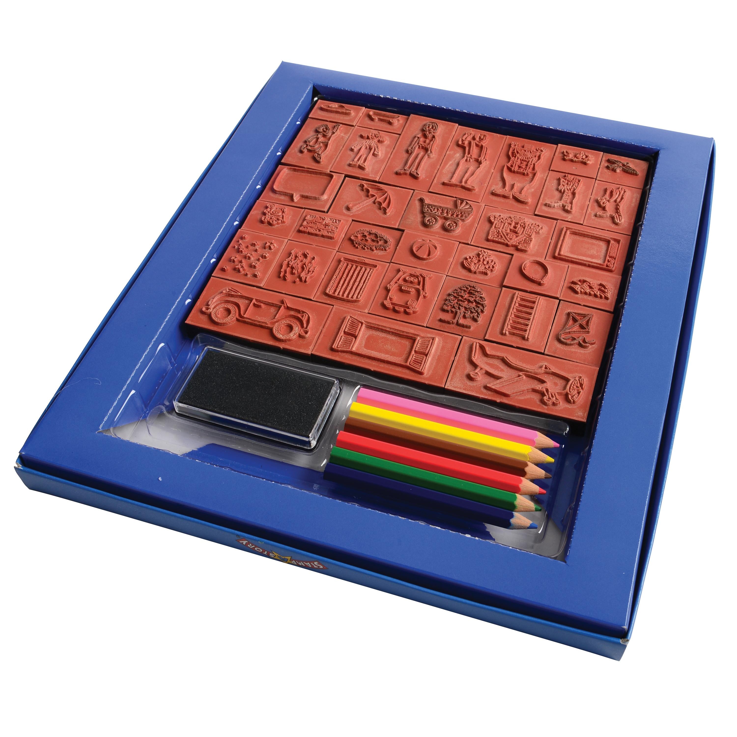 A children's art and craft kit in a blue box, featuring a red rubber stamp set, a black ink pad, and five colored pencils (pink, yellow, orange, green, blue) visible through a clear plastic window.