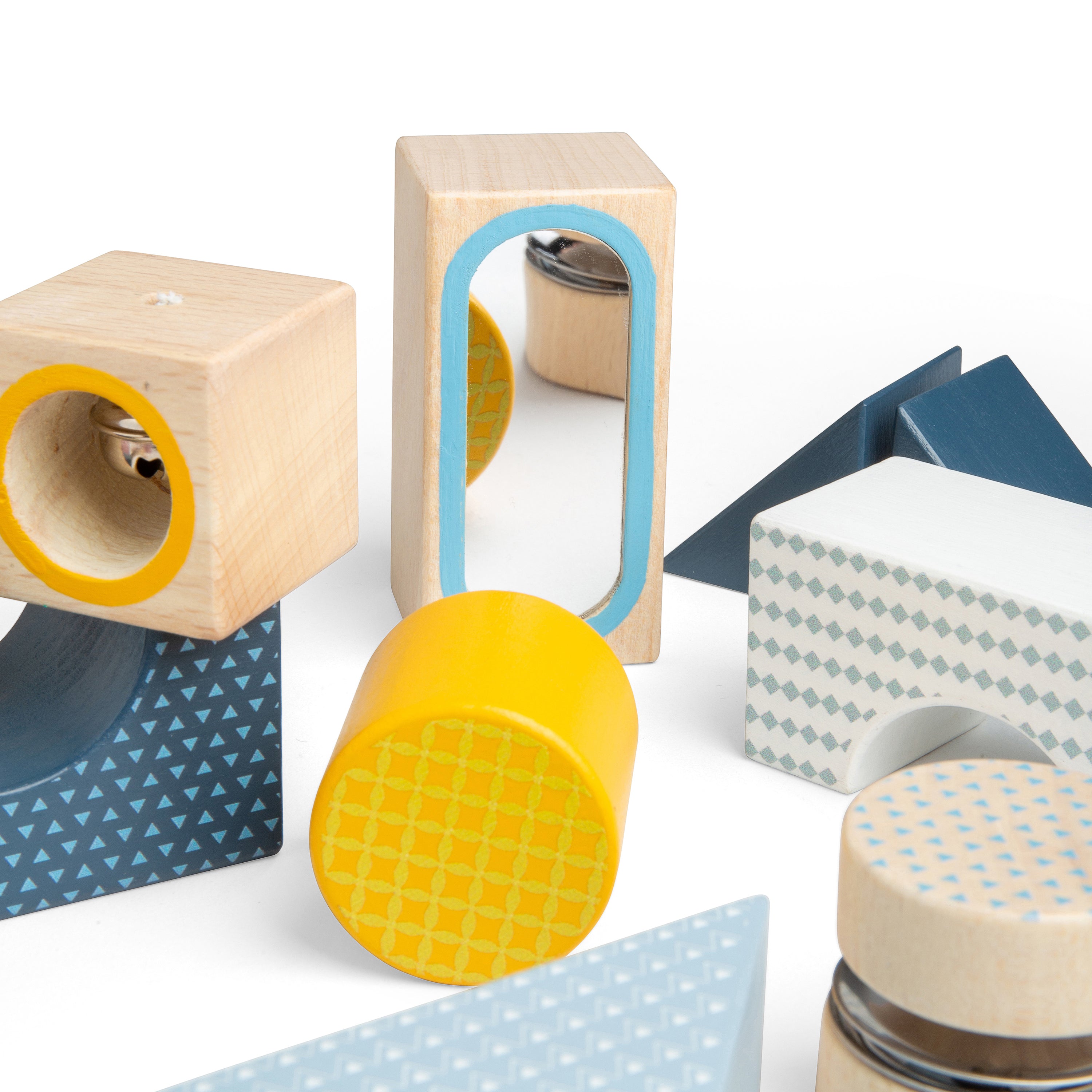 Wooden geometric shape blocks with patterns on a white background