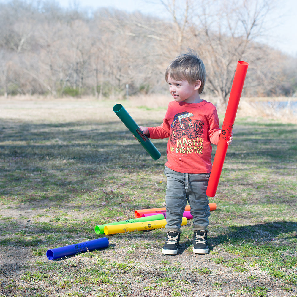 Toddler Holding 2 Boomwhackers® Musical Tubes