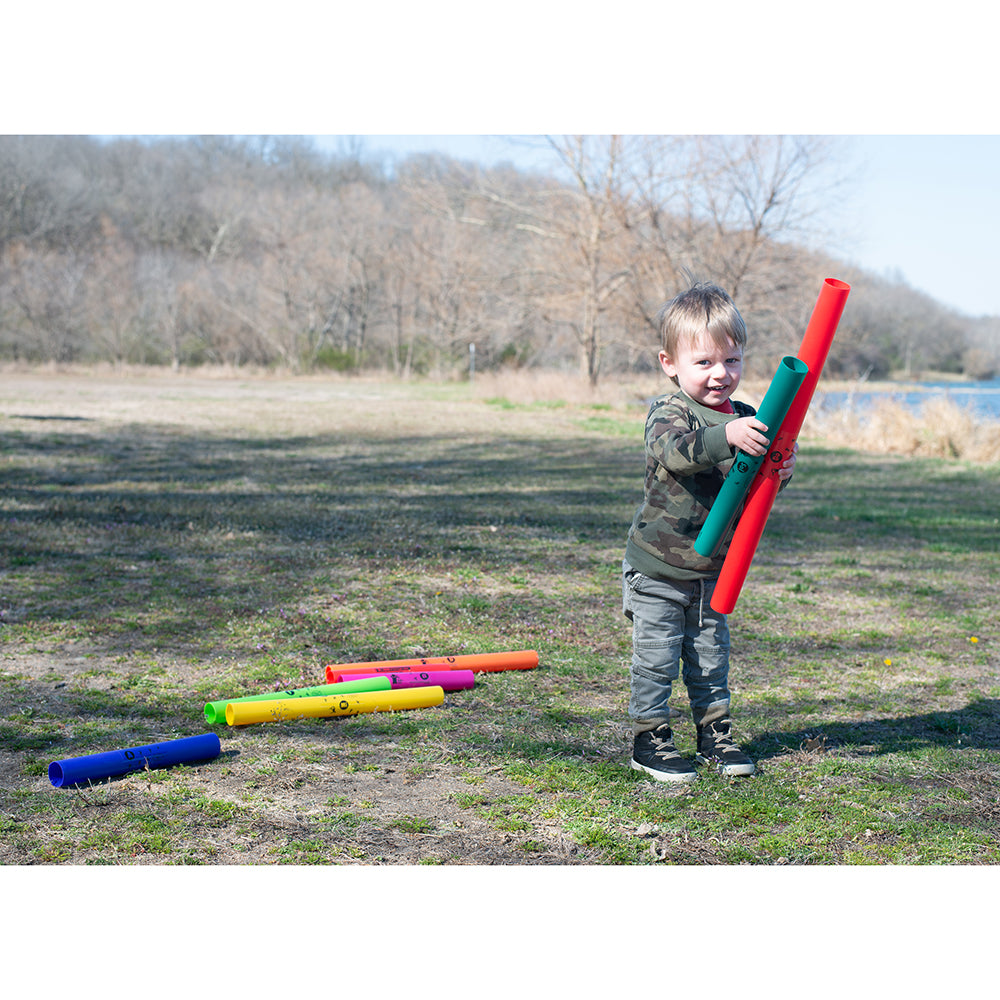 Small Kid Holding Two Boomwhackers® Musical Tubes