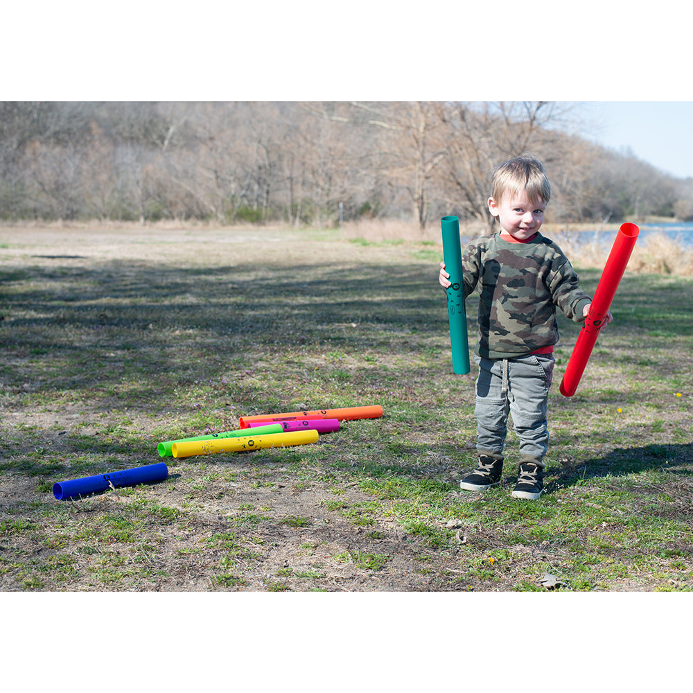 Small Child Holding 2 Boomwhackers® Musical Tubes