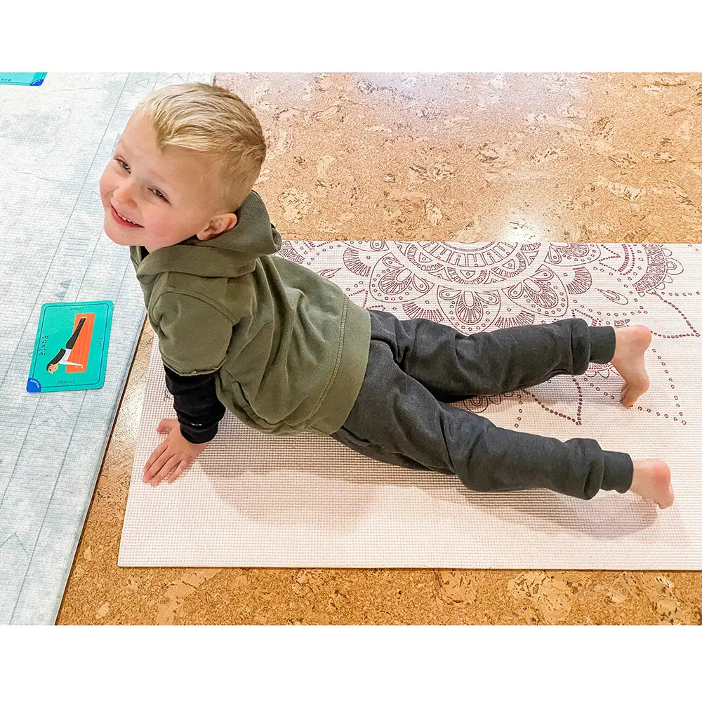 Kid Learning Stretching Techniques with Healthy Bodies, Healthy Minds Yoga & Wellness Activity Card Set