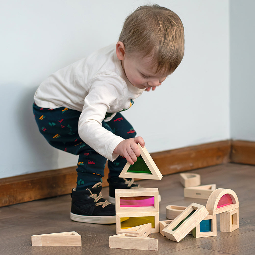 Toddler Adding Triangle Block to His Stack
