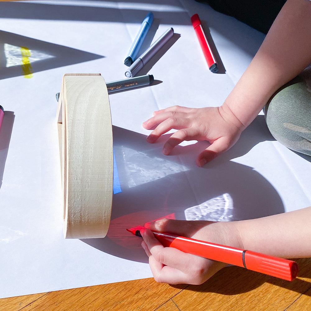 Kid using glitter water blocks in art
