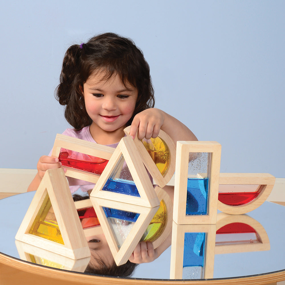 Glitter water blocks on mirrored table