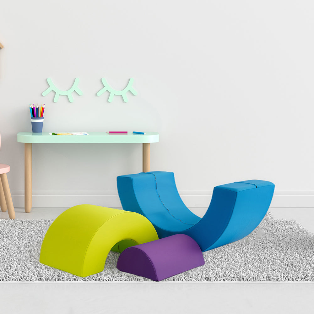 Colorful foam arches in a room with a small table and decor.