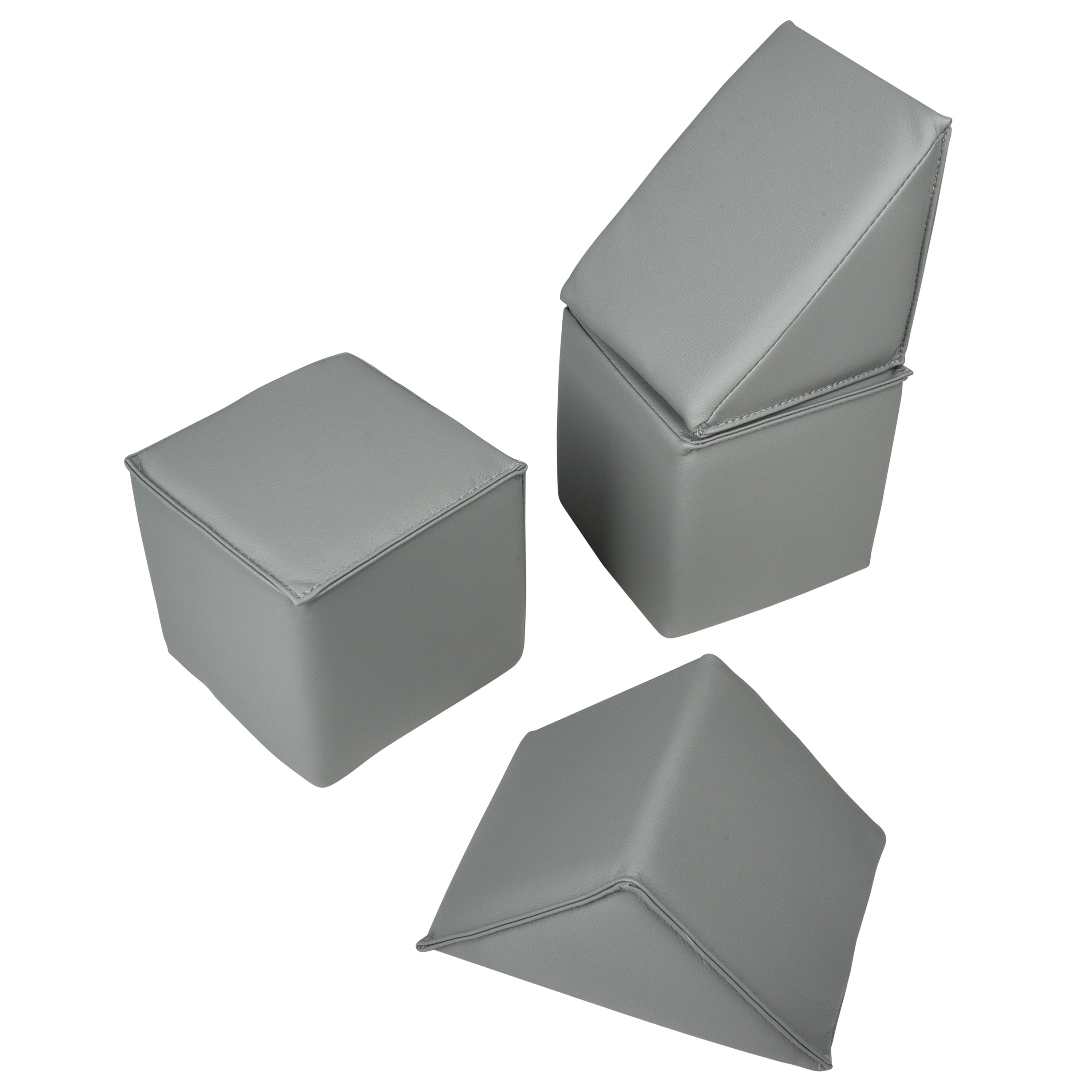 Three gray geometric foam blocks on a white background