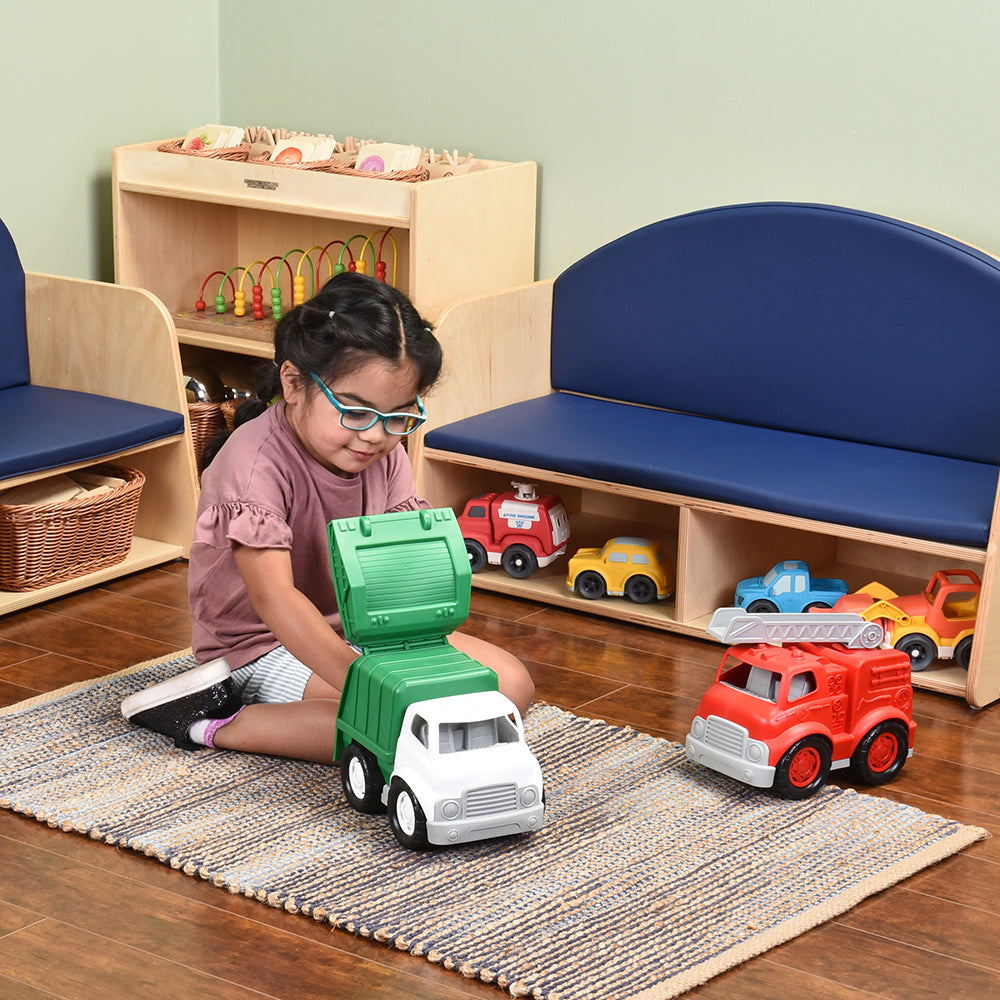 Kid in Classroom Exploring Toy Recycle Truck