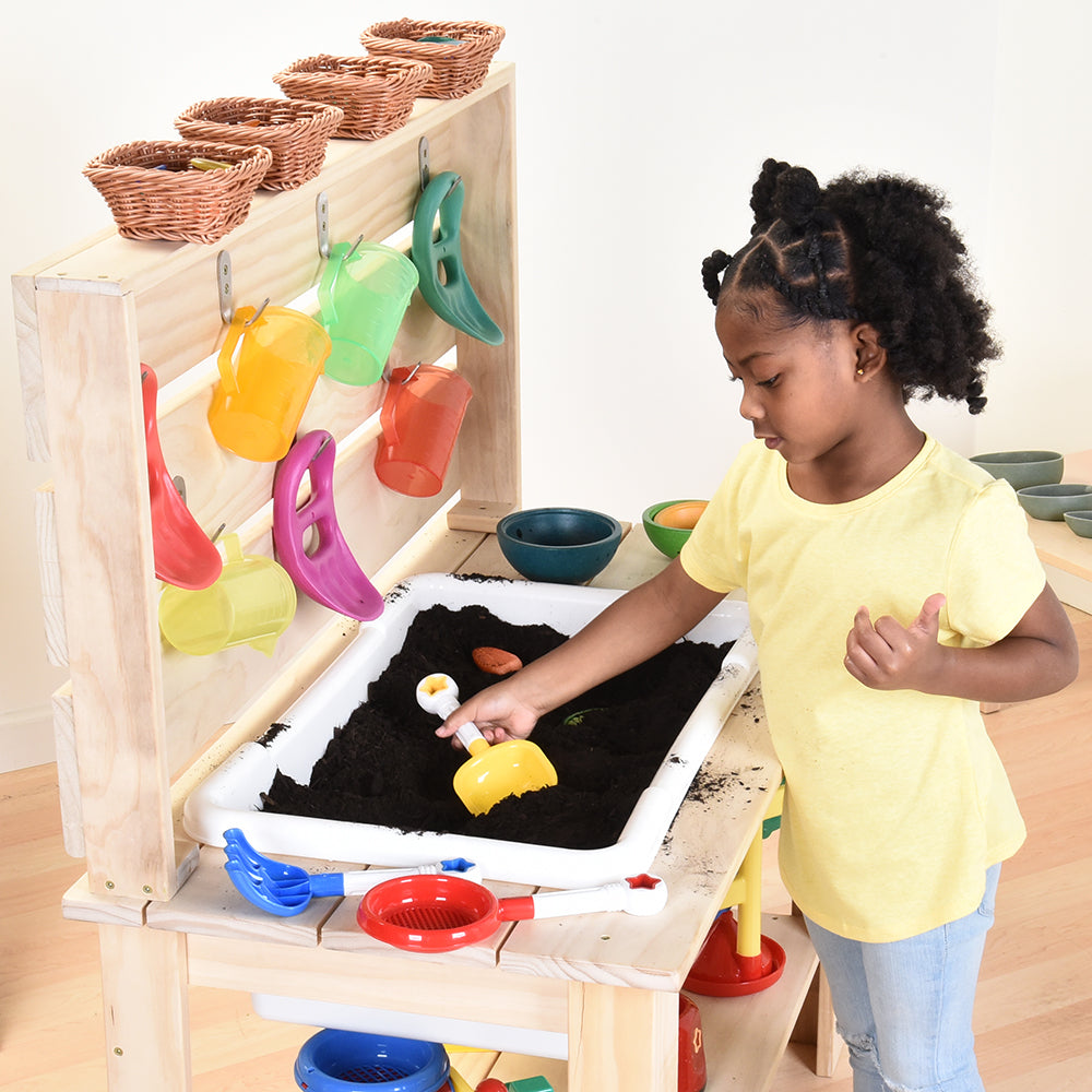Scooping Dirt with Eco-Friendly Mud Kitchen