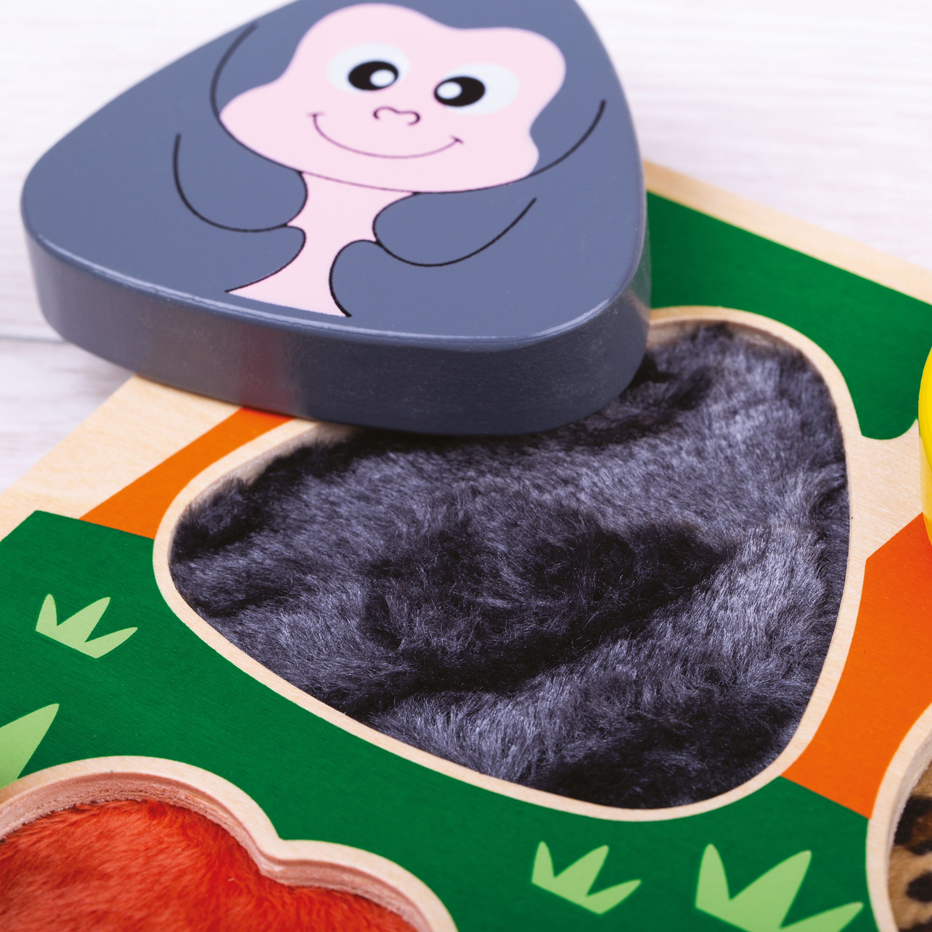 Toy with a heart-shaped piece featuring a cartoon character on a colorful background