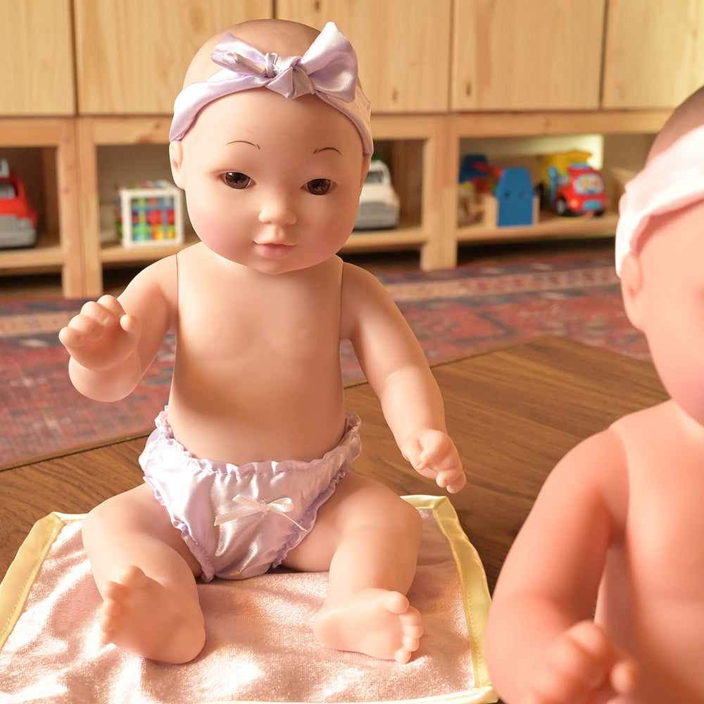 Asian Tender Touch baby Doll in Classroom