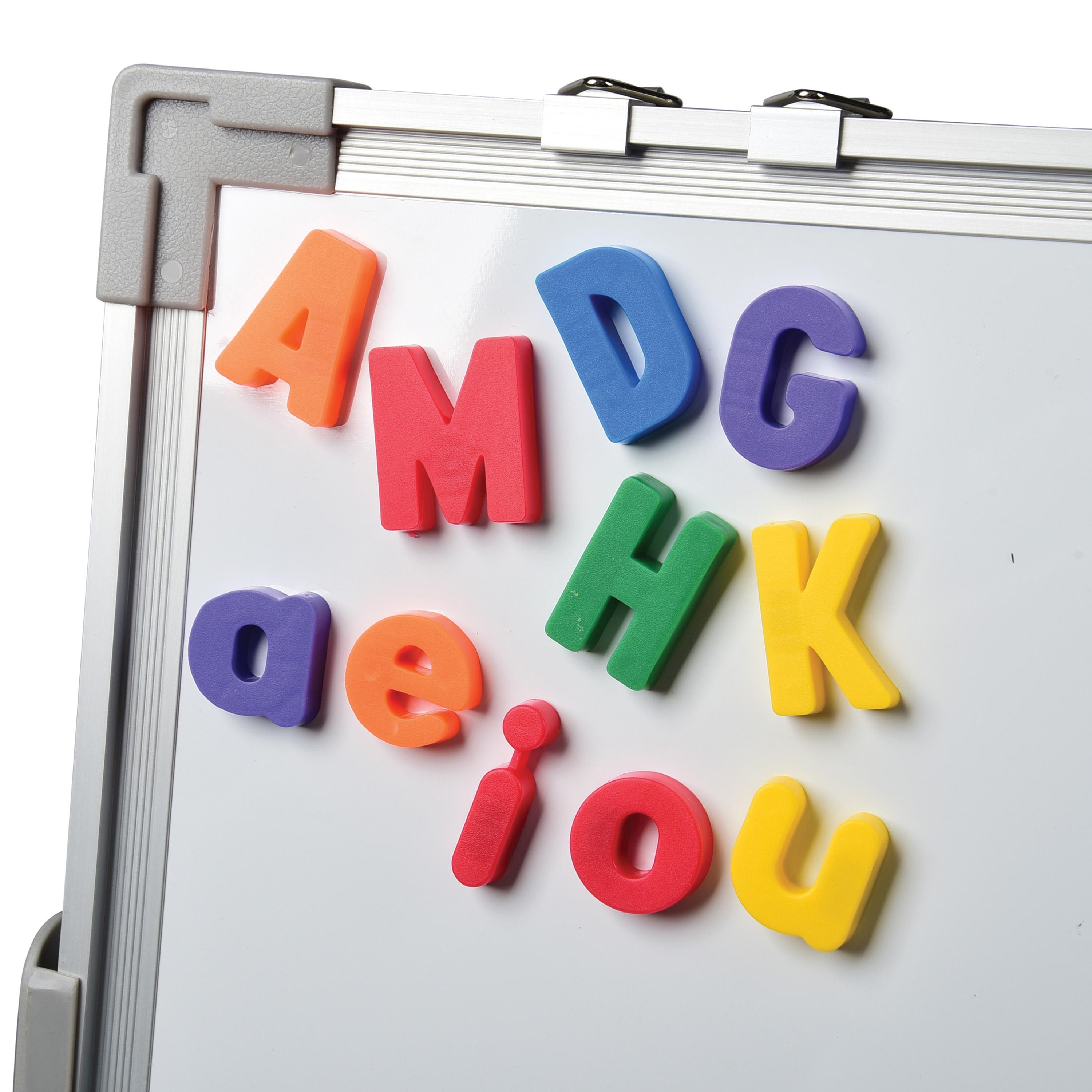 Colorful magnetic letters on a whiteboard
