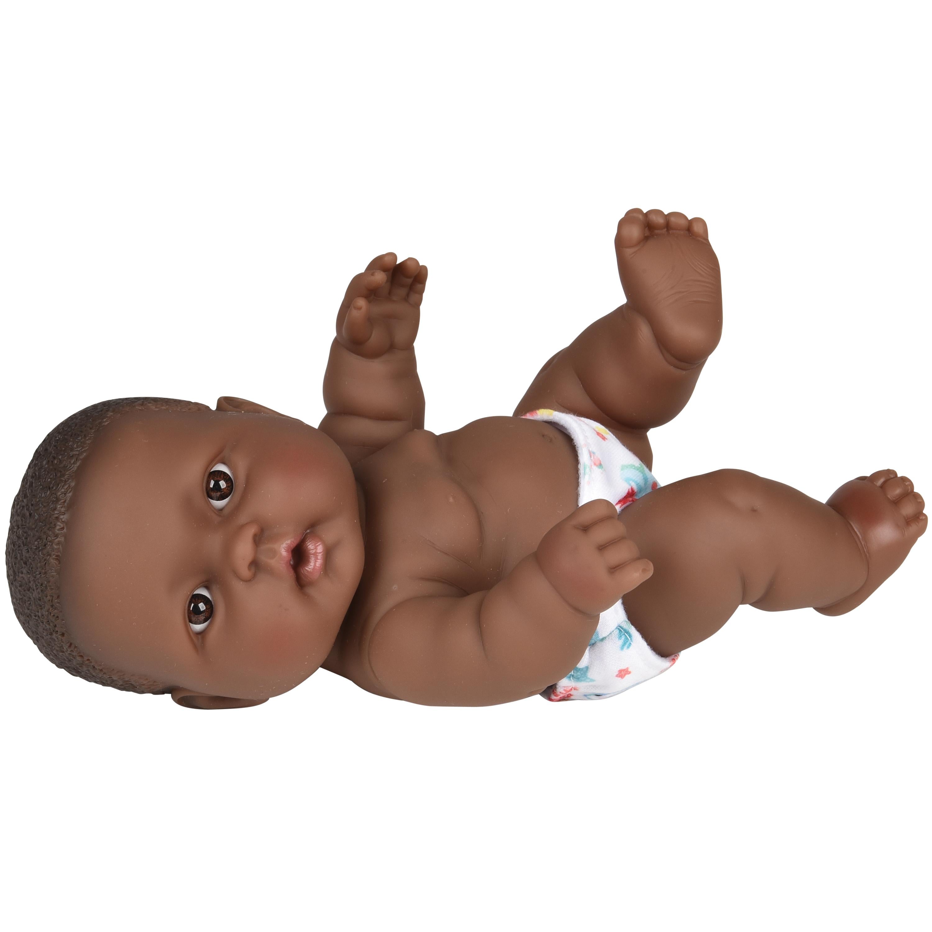 Baby doll with dark skin tone wearing a diaper on a white background