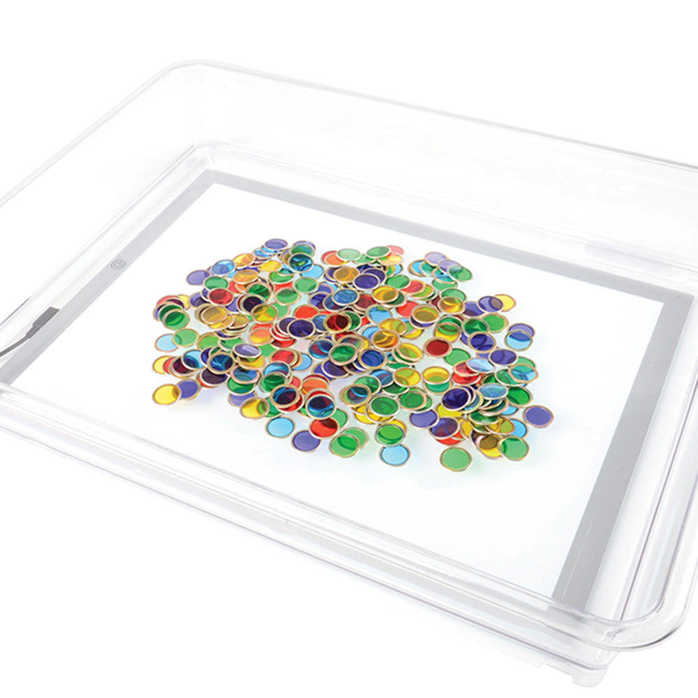 Colorful Metal Ringed Chips on a Light Table