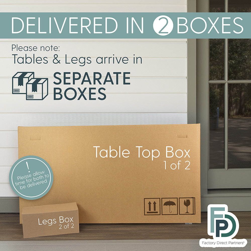 Cardboard box labeled 'Table Top Box 1 of 2' with a smaller box labeled 'Legs Box 2 of 2' on a wooden floor.