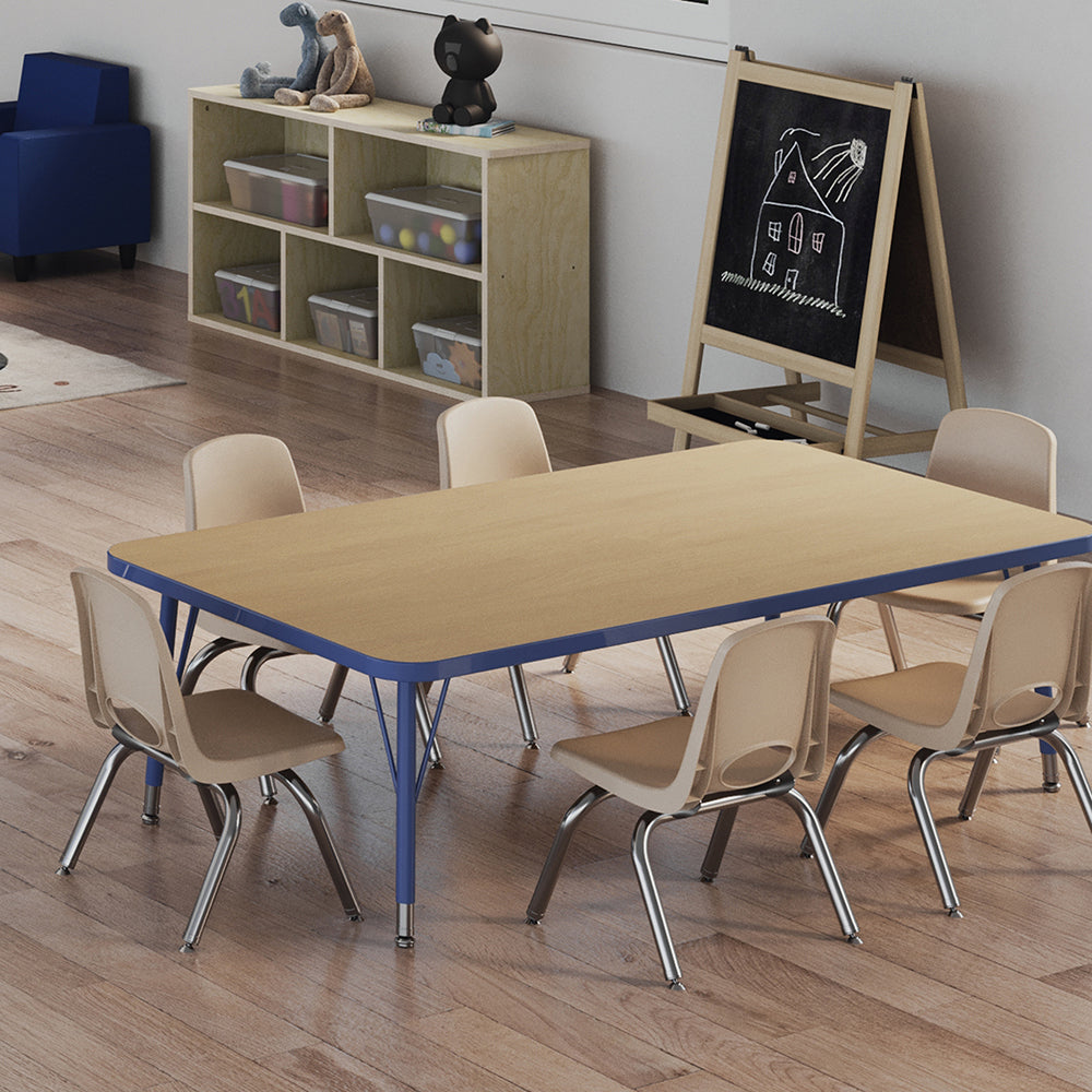 Children's classroom setup with a table and chairs in a room with a chalkboard and storage shelves.