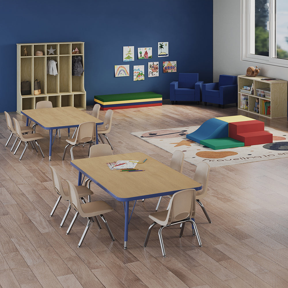 Children's classroom with tables, chairs, and colorful play equipment.