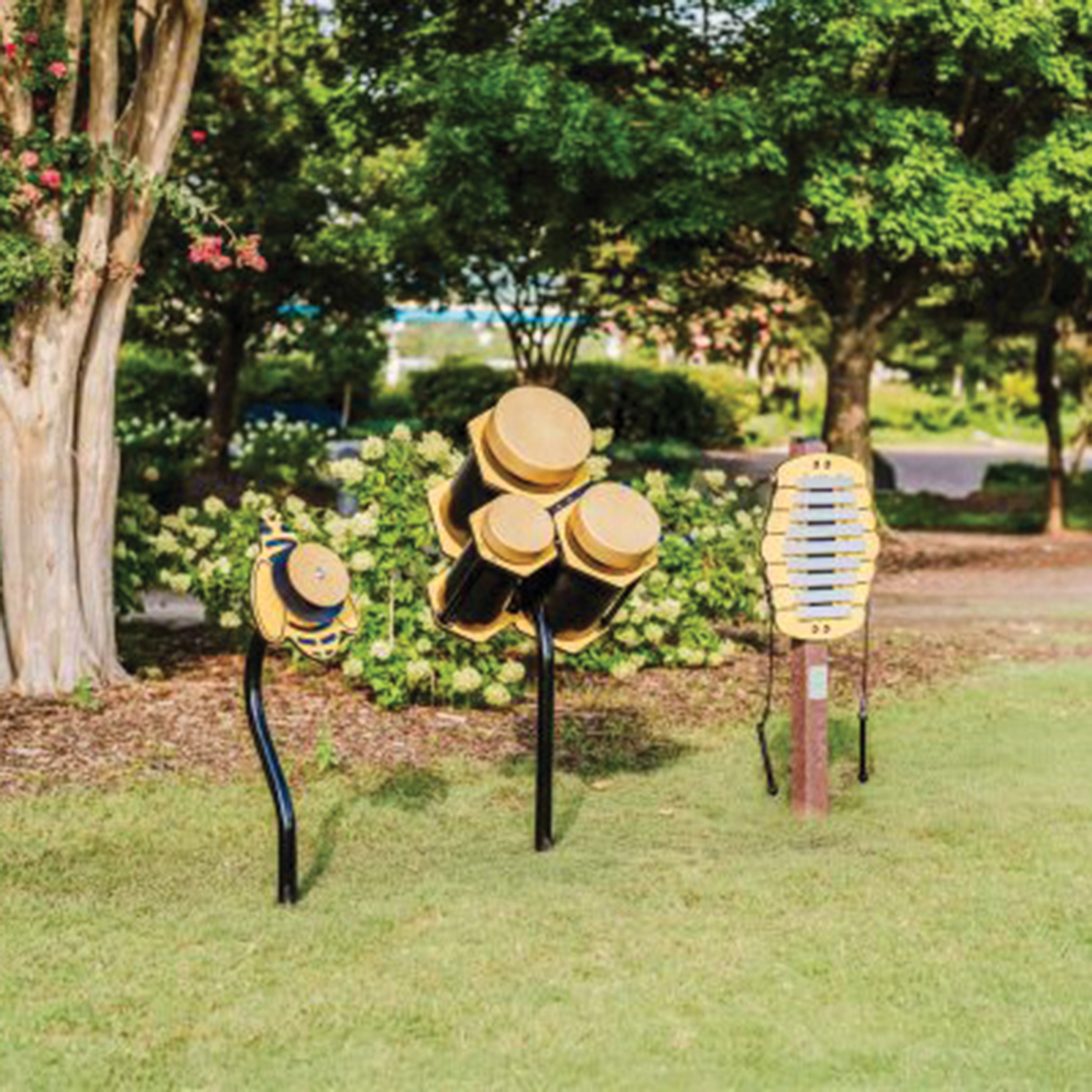 Playground musical panels on stands in a grassy area