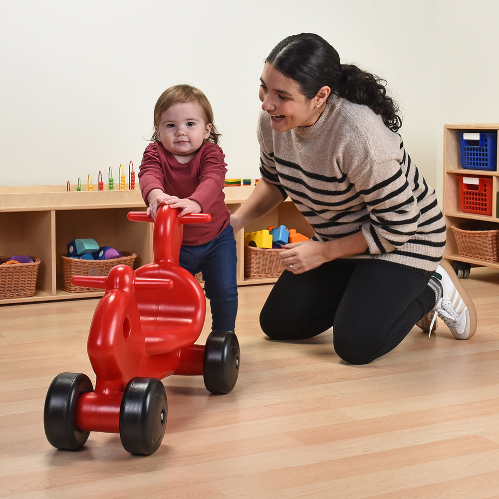 Toddler Interacting with Push-N-Ride Pal in the classroom