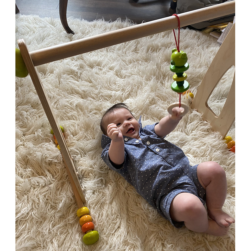 Laughing Baby Enjoying Play Gym