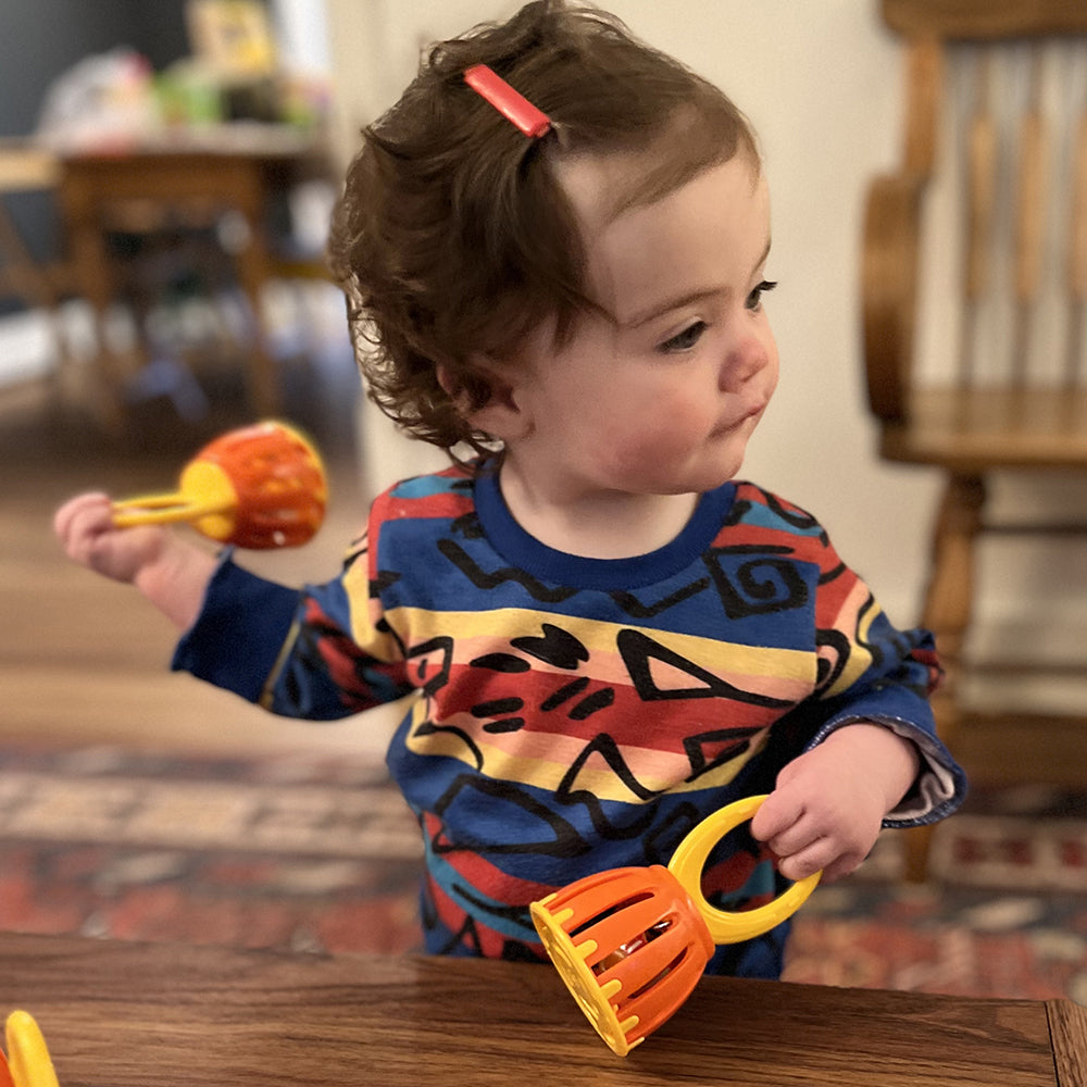 Toddler with 2 Baby Bells