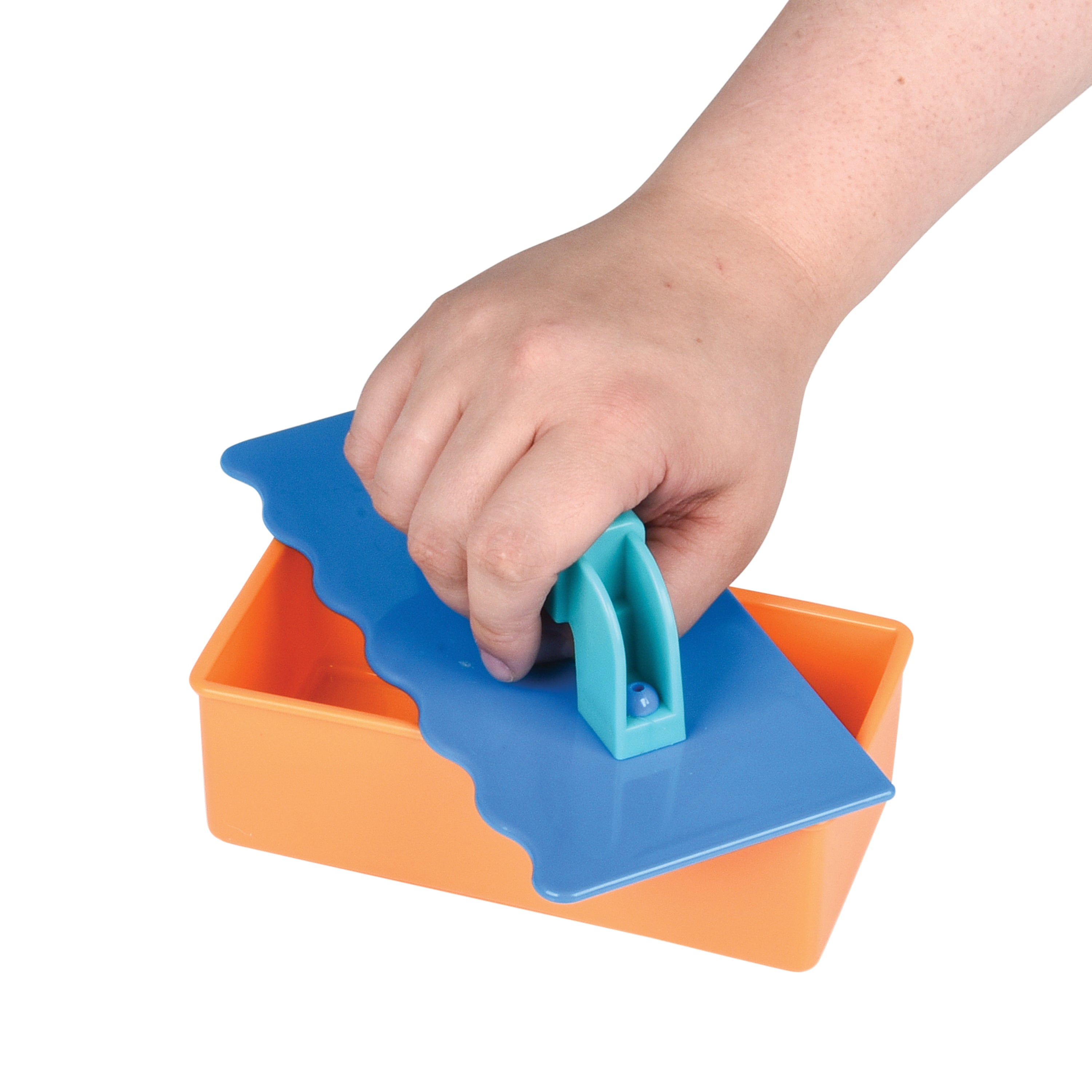 Hand using a blue plastic tool to open an orange container on a white background