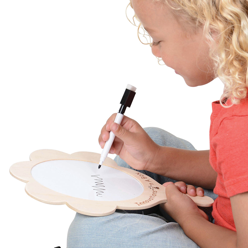 Child Writing with Dry Erase Marker on Mirror