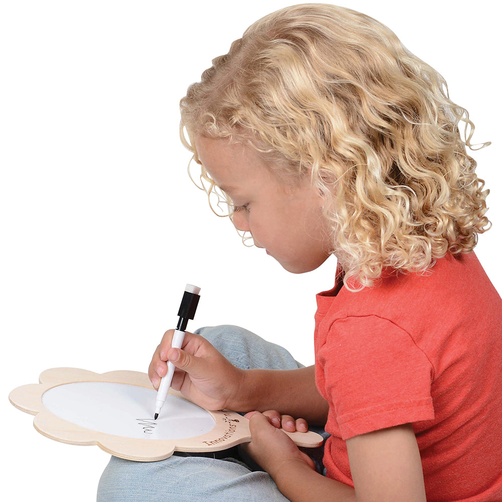 Child Writing with Dry Erase Marker on Mirror