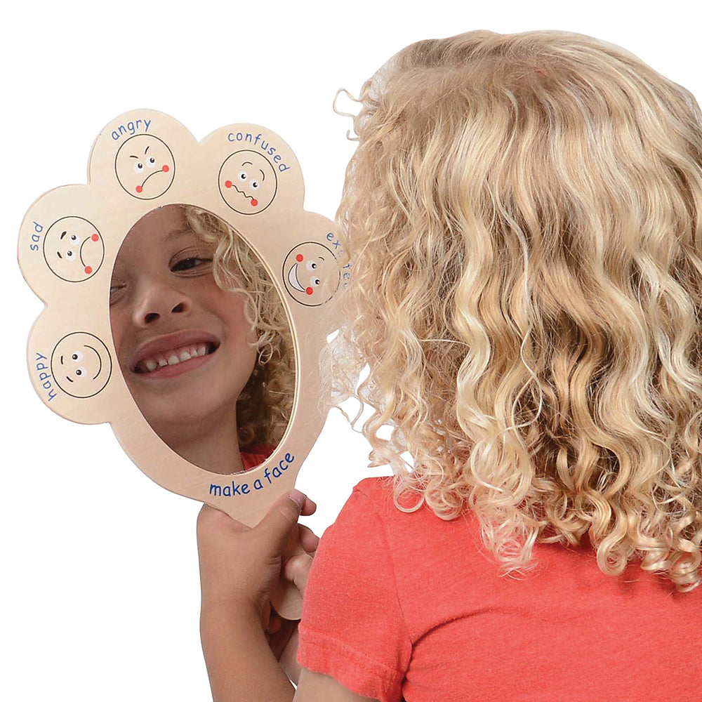 Kid Exploring Emotions Through Use of Mirrors