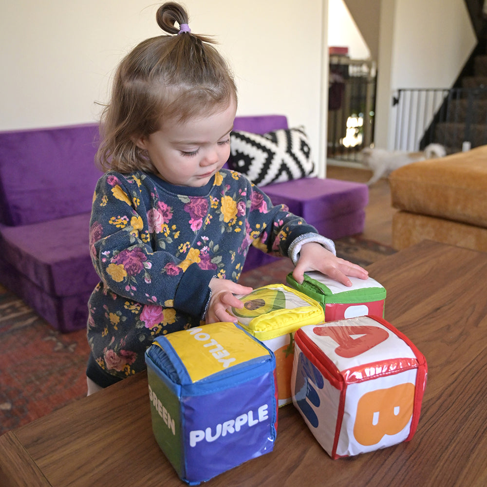 Toddler Interacting with 4 Piece Set of Blocks