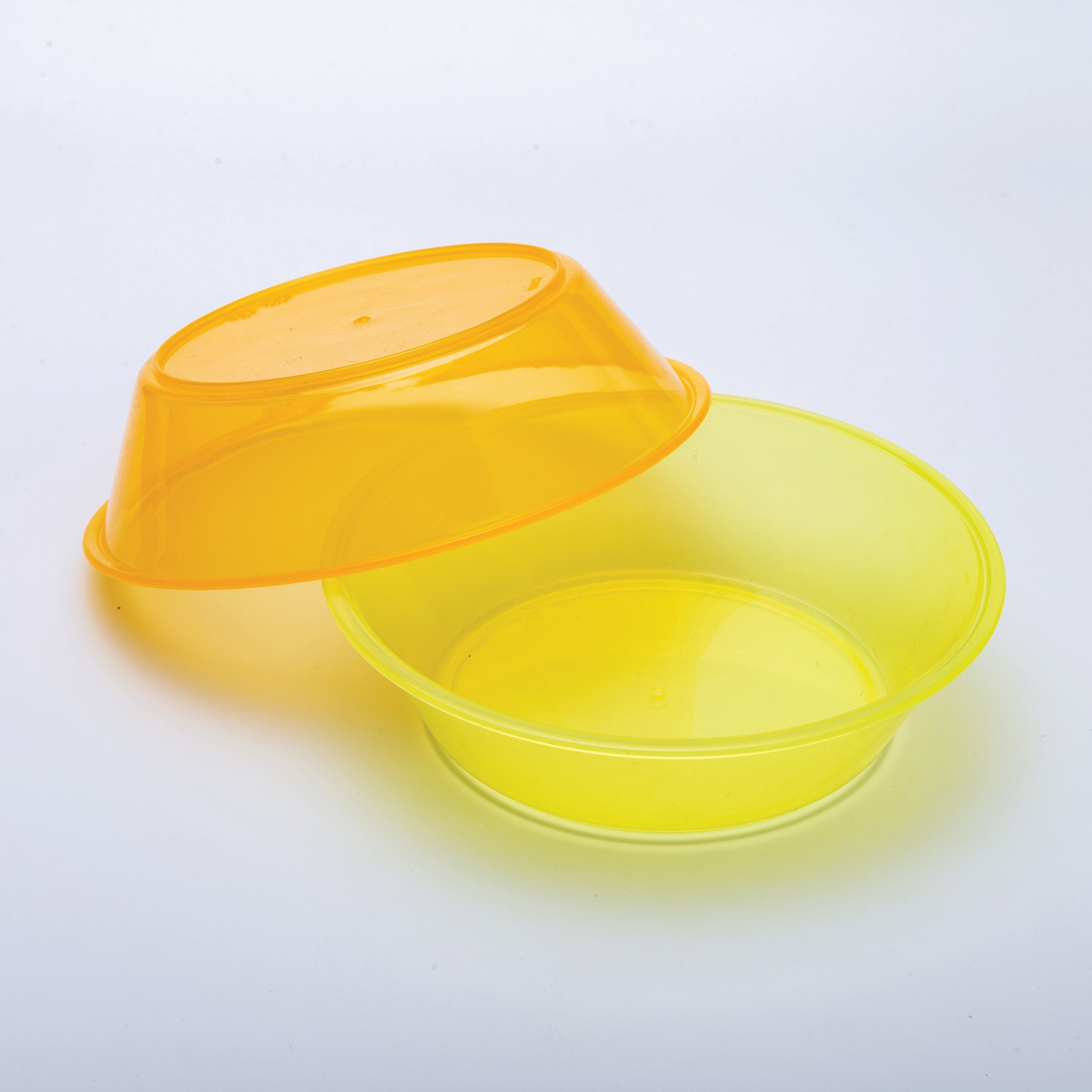 Yellow plastic container with an orange bowl on a light gray background