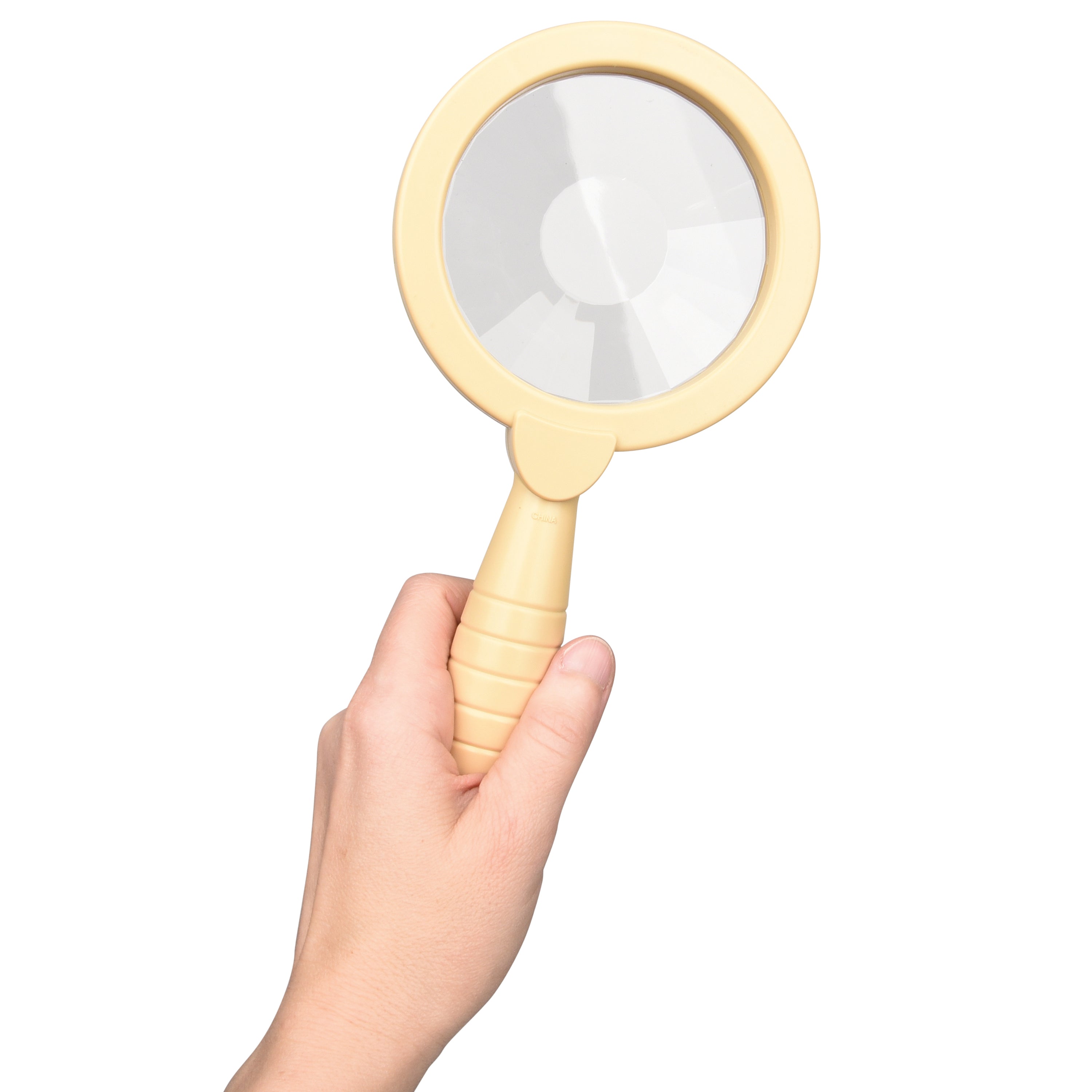 Hand holding a yellow magnifying glass on a white background