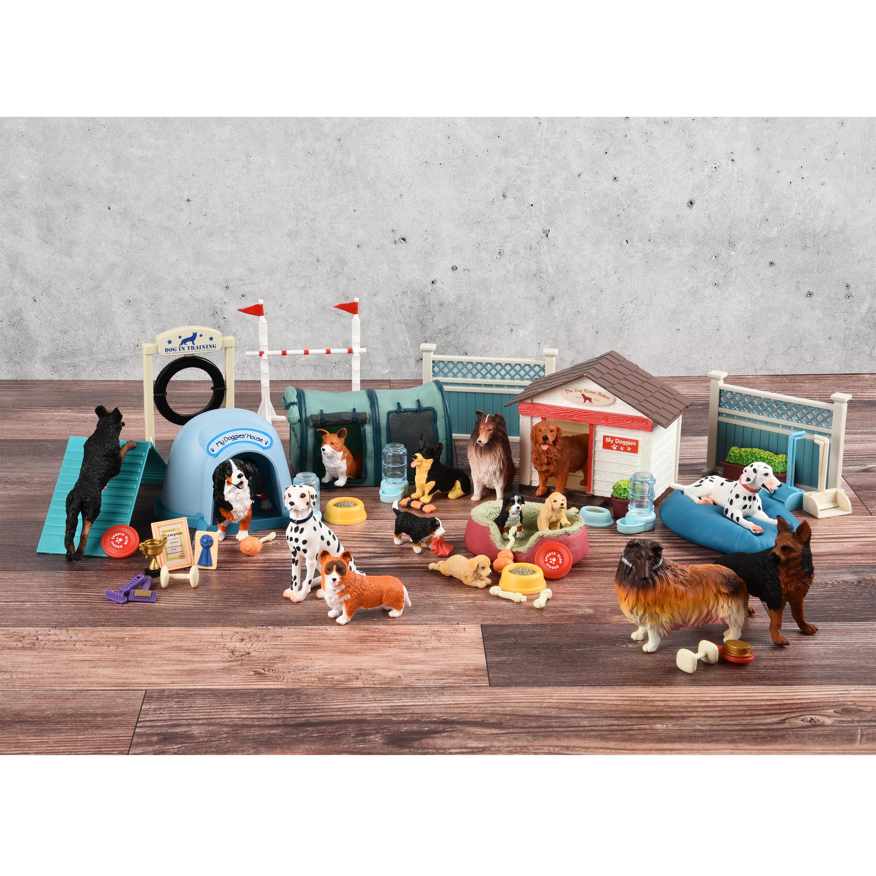 Collection of dog-themed toys on a wooden floor with a concrete wall background