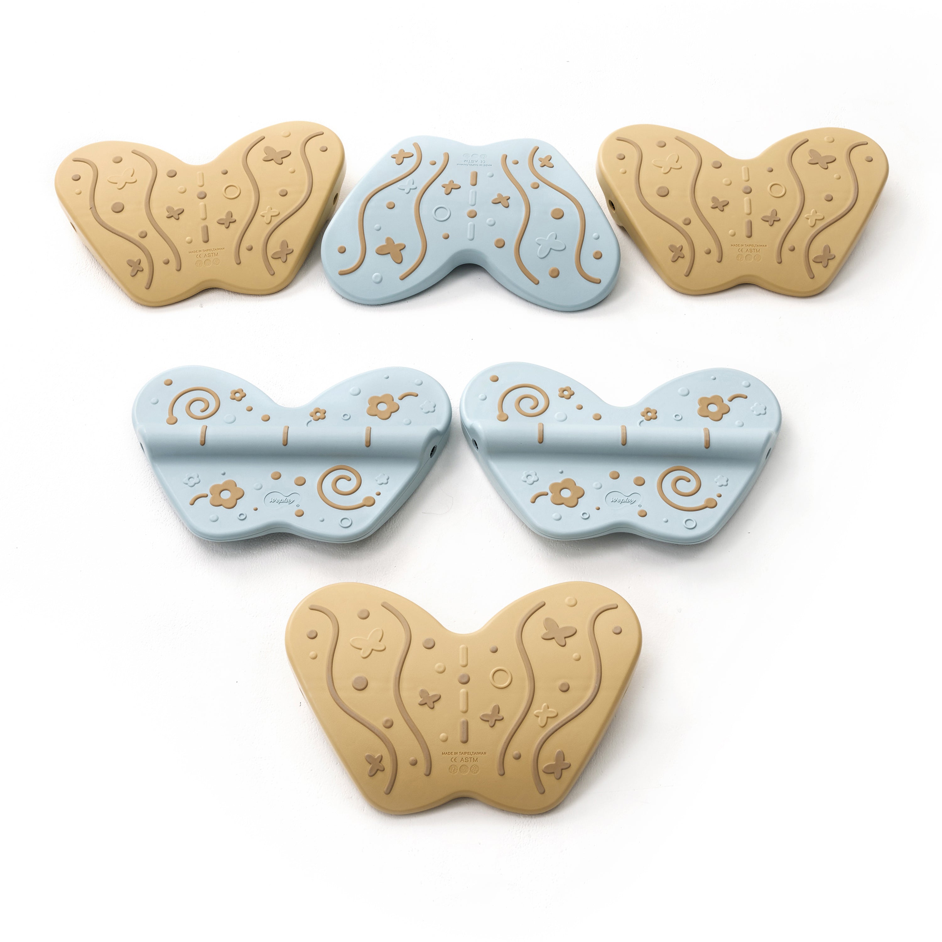 Set of butterfly-shaped balance boards in blue and beige on a white background