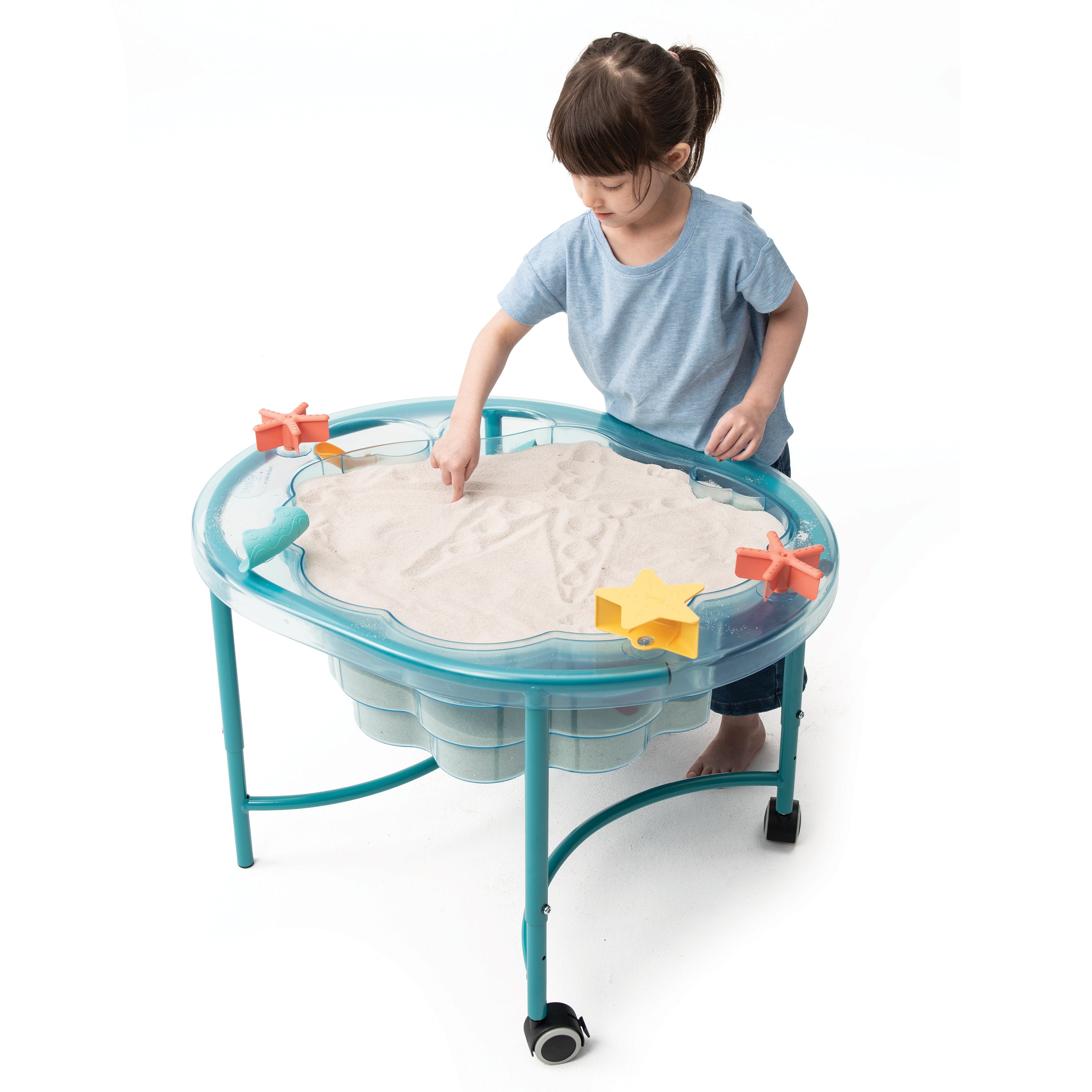 Child playing with a sand table on a white background