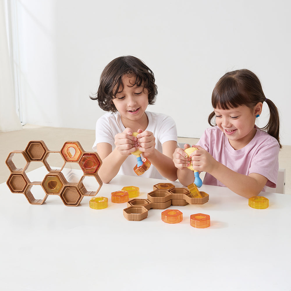 Two Kids Engaging with Squeezy Bee Blocks | Buzz & Build Beehive Challenge Play Set