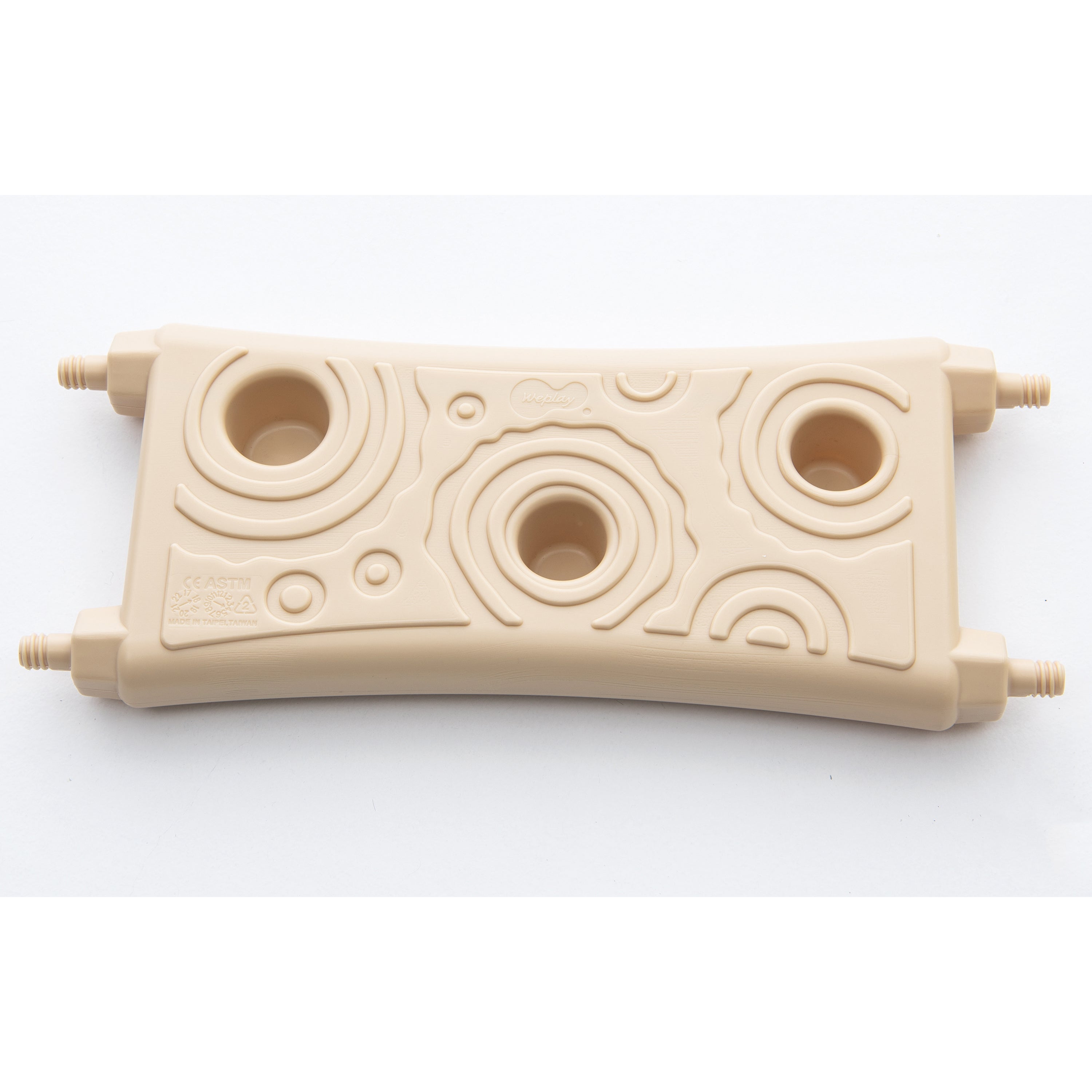 Beige plastic component with circular holes and small protrusions on a white background