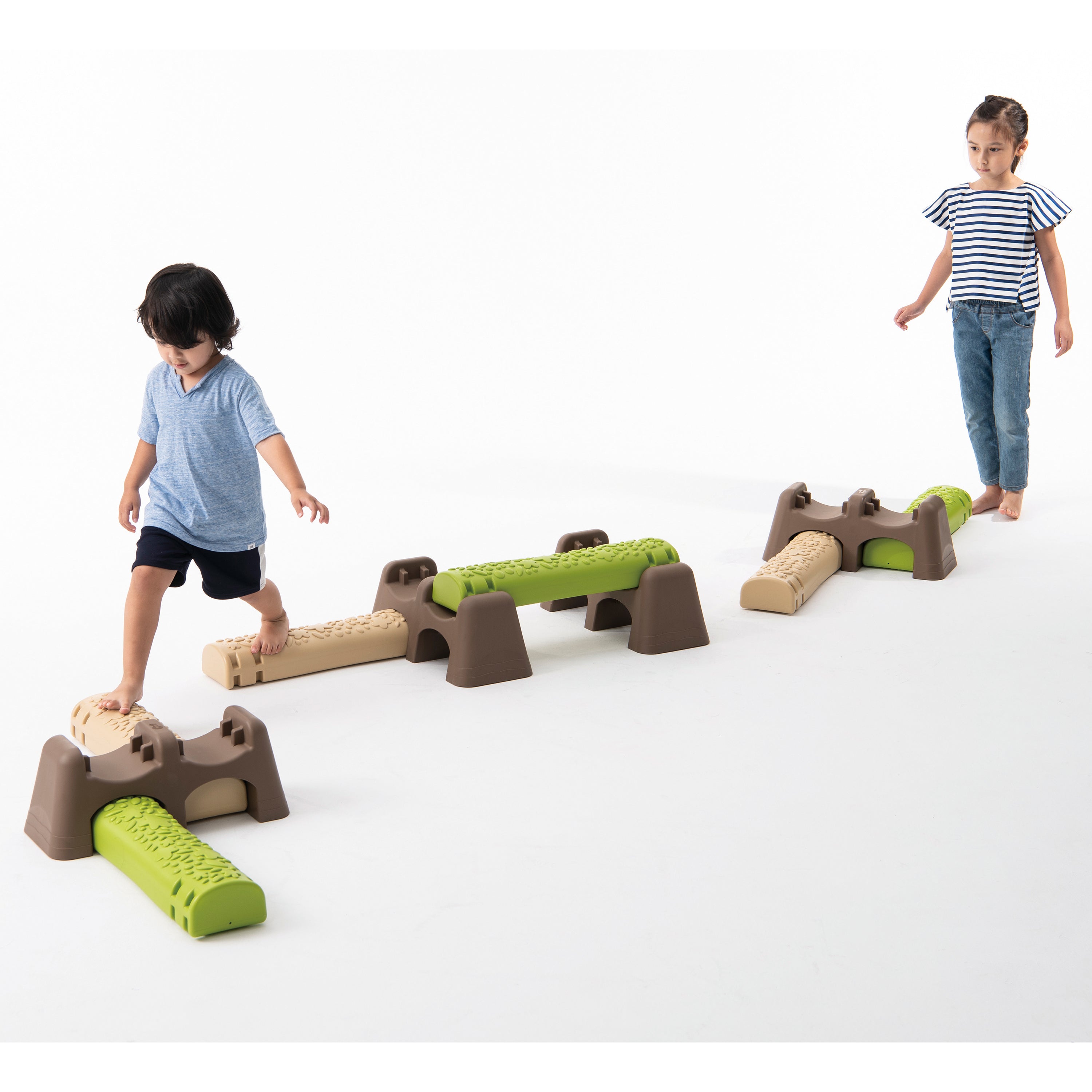 Children playing with a set of playground structures on a white background