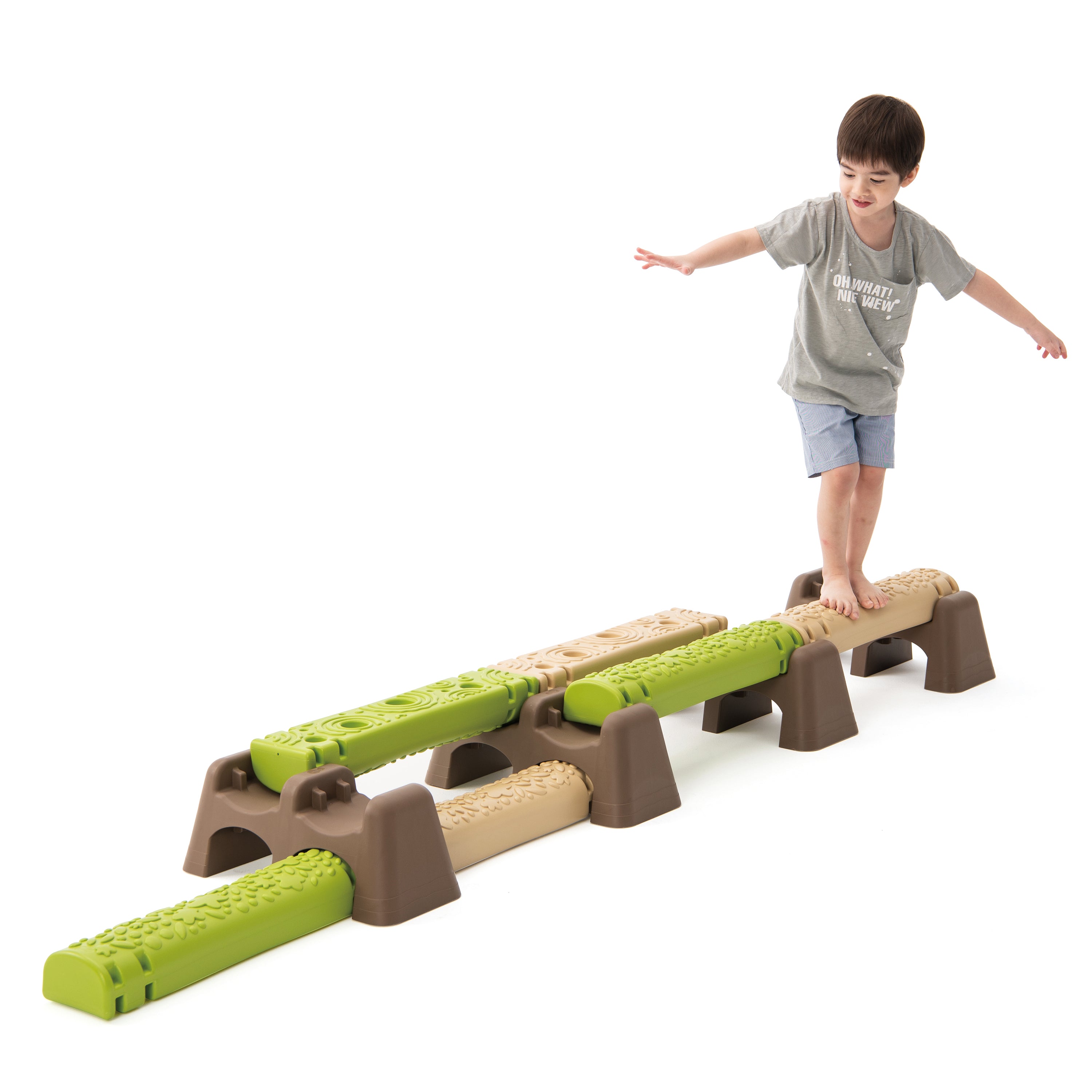Child playing with a balance beam toy on a white background