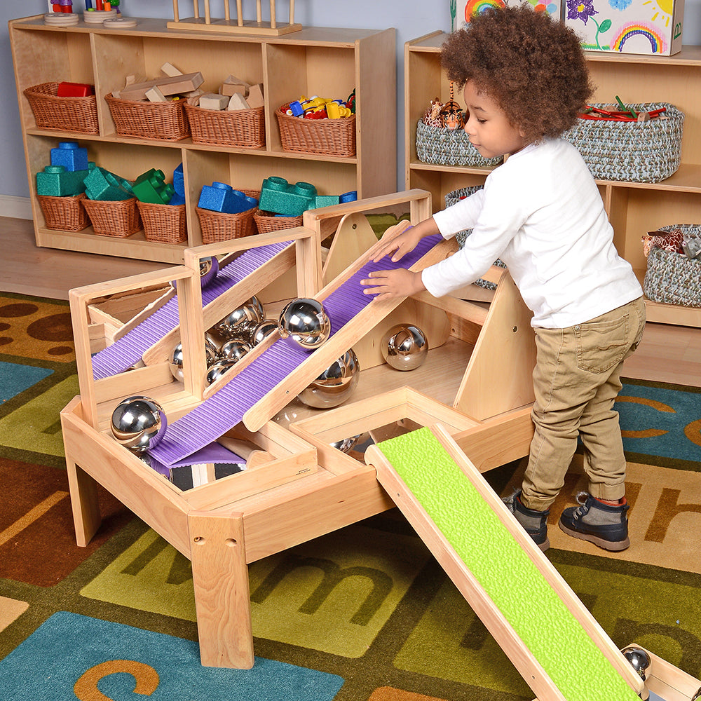 Using Mirrors and Ramps for Fun on the Toddler Manipulative Table