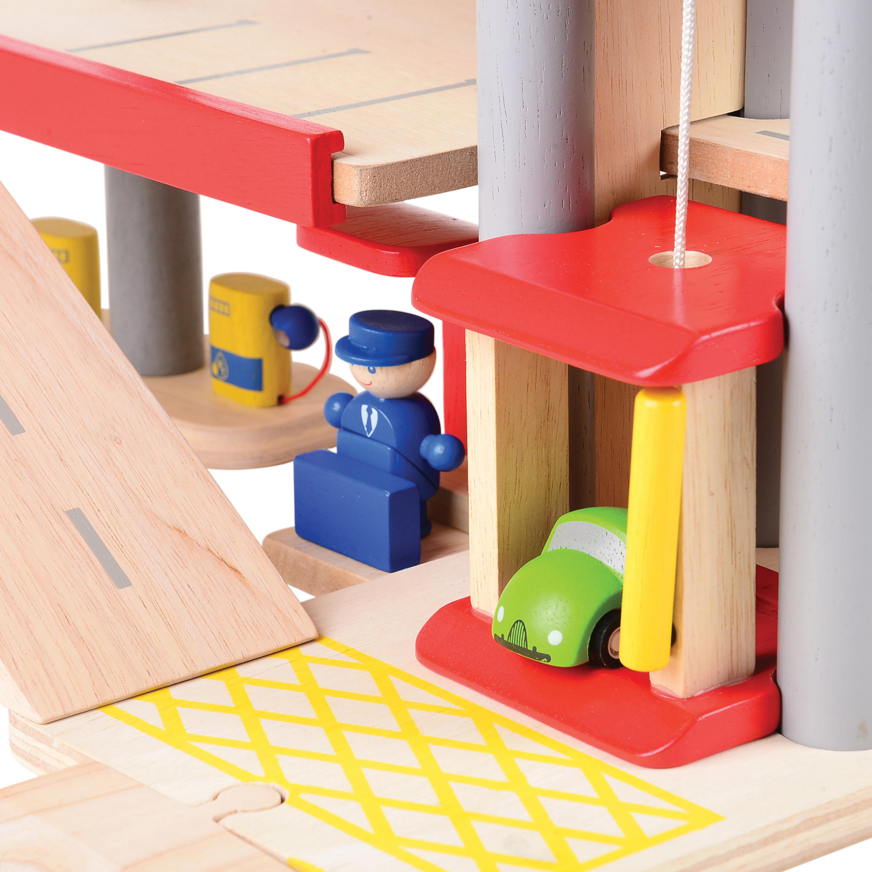 Wooden toy set with red platform, blue figure, and green car on a white background