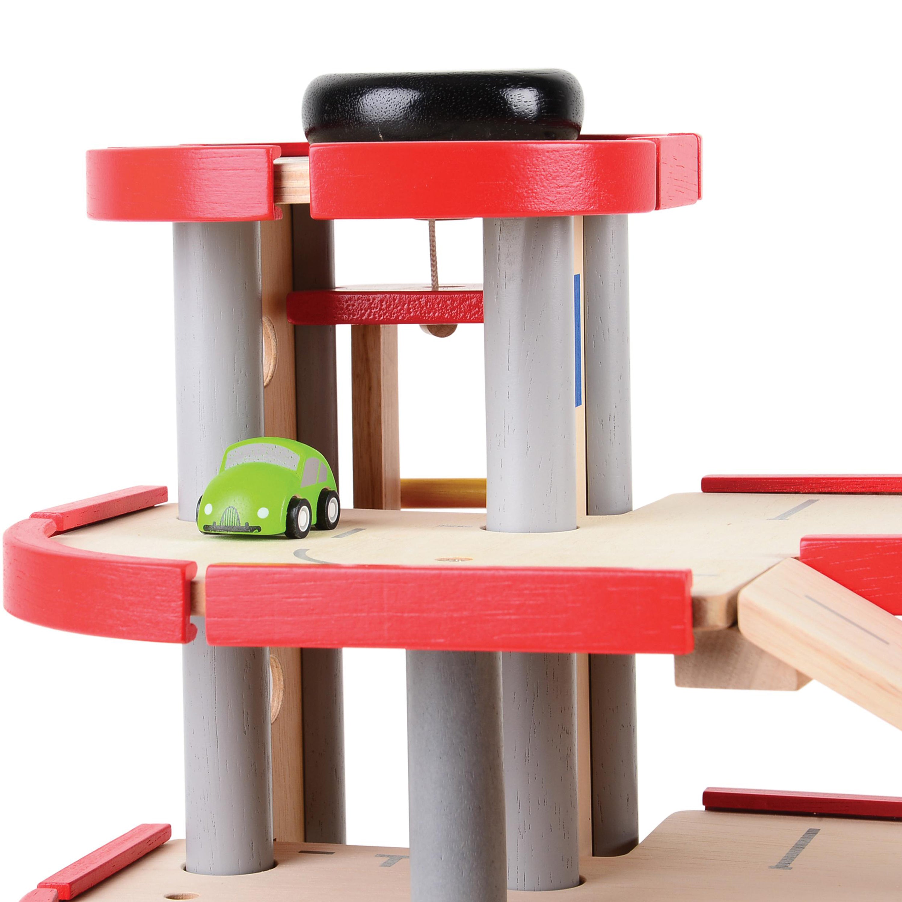 Toy car track set with a green toy car on a white background