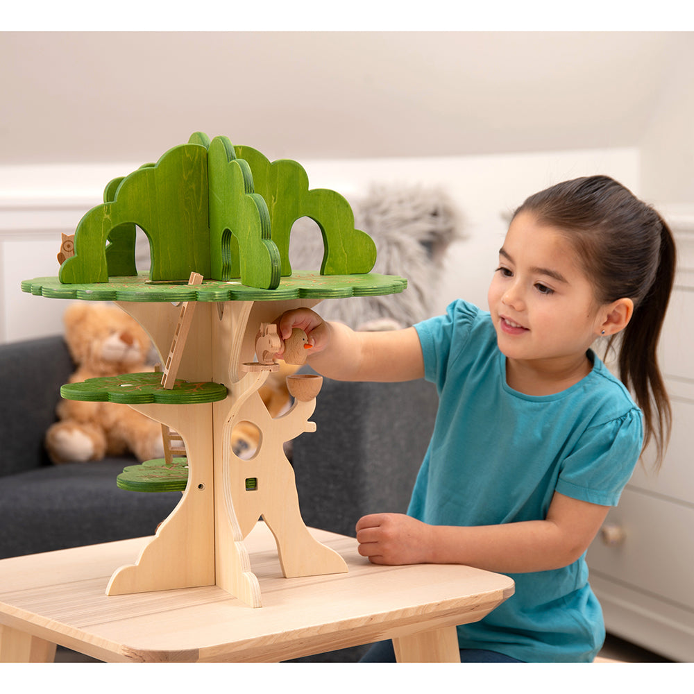 Kid Playing With 3-Tier Woodland Treehouse Playset