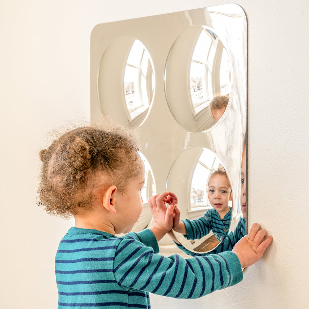 Toddler Interacting with Her Own Reflection in Acrylic Wall Bubble Dome Mirror