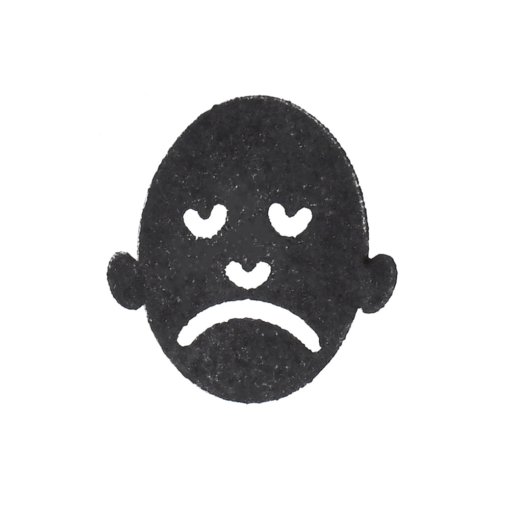 Sad Face Stamped on Paper
